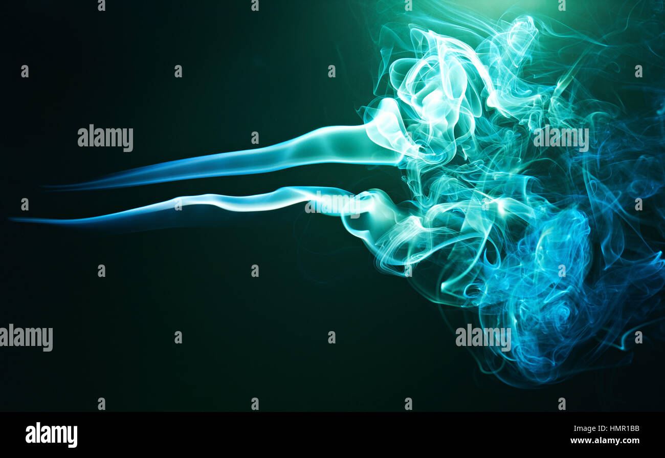 green smoke waves isolated on black background Stock Photo - Alamy