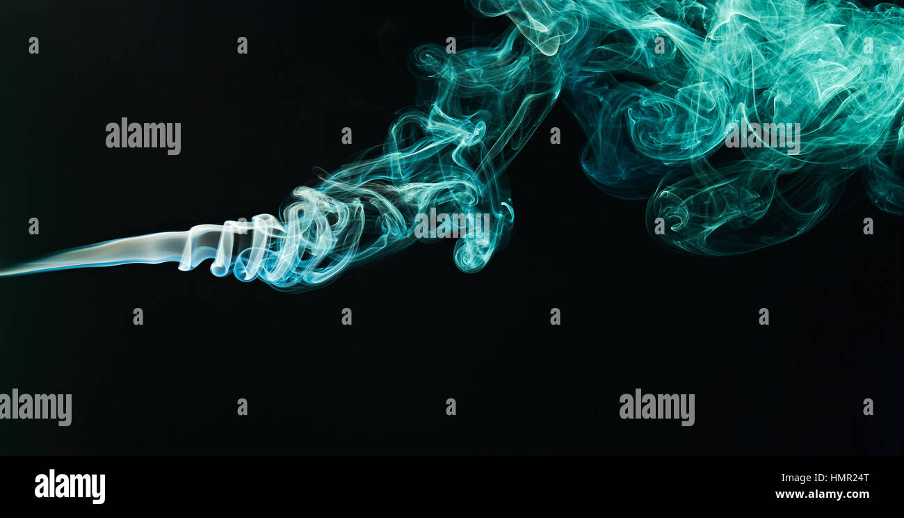 green smoke curlys on black background isolated Stock Photo