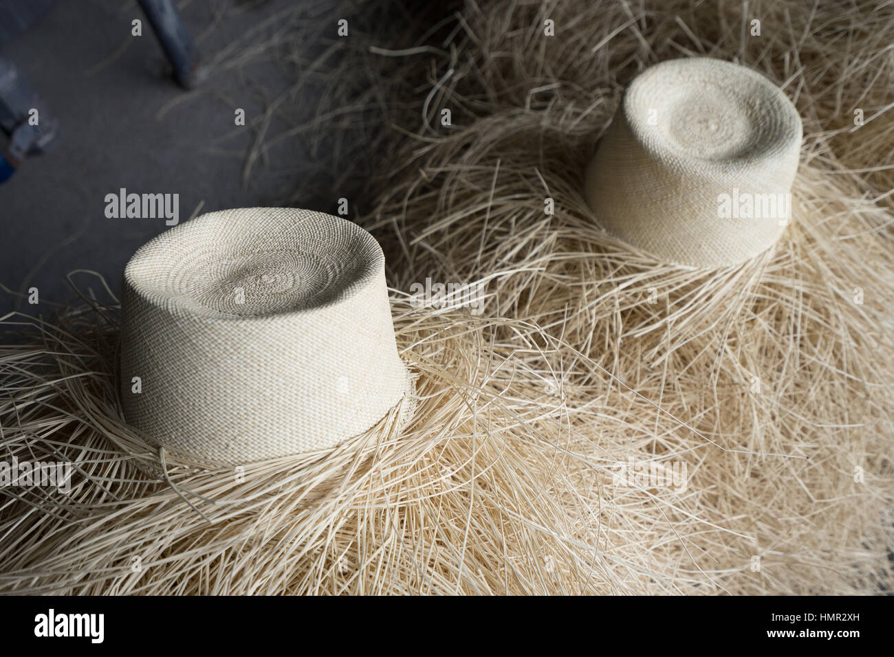 straw panama hat unfinished handcrafted, market, outdoors, street, vendor traditional,South America, Ecuador, Cuenca Stock Photo