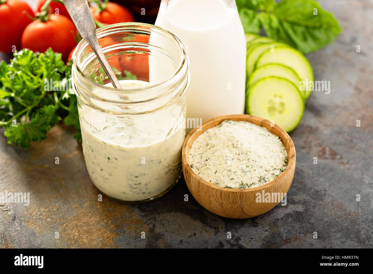 Making ranch dressing from a dry mix with milk and yogurt Stock Photo