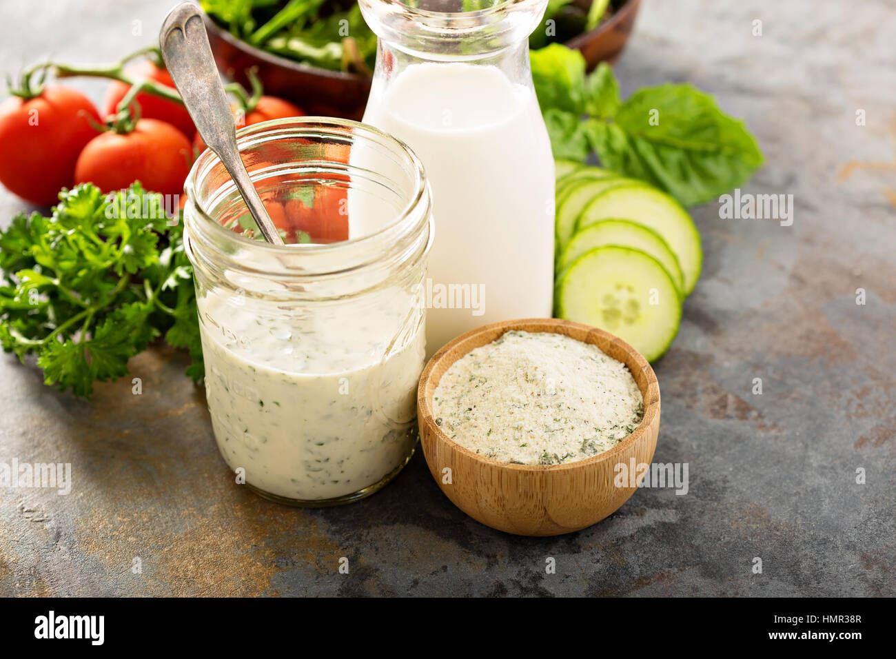 Making ranch dressing from a dry mix with milk and yogurt Stock Photo