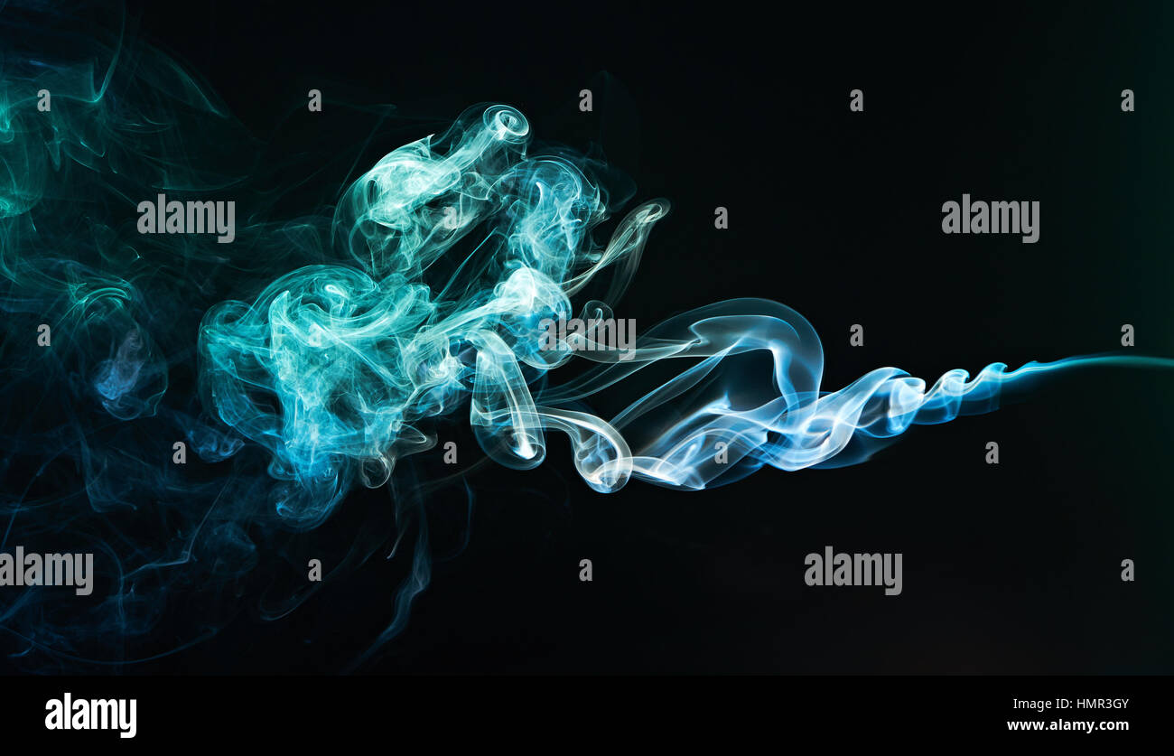 green and blue smoke waves isolated on black Stock Photo - Alamy