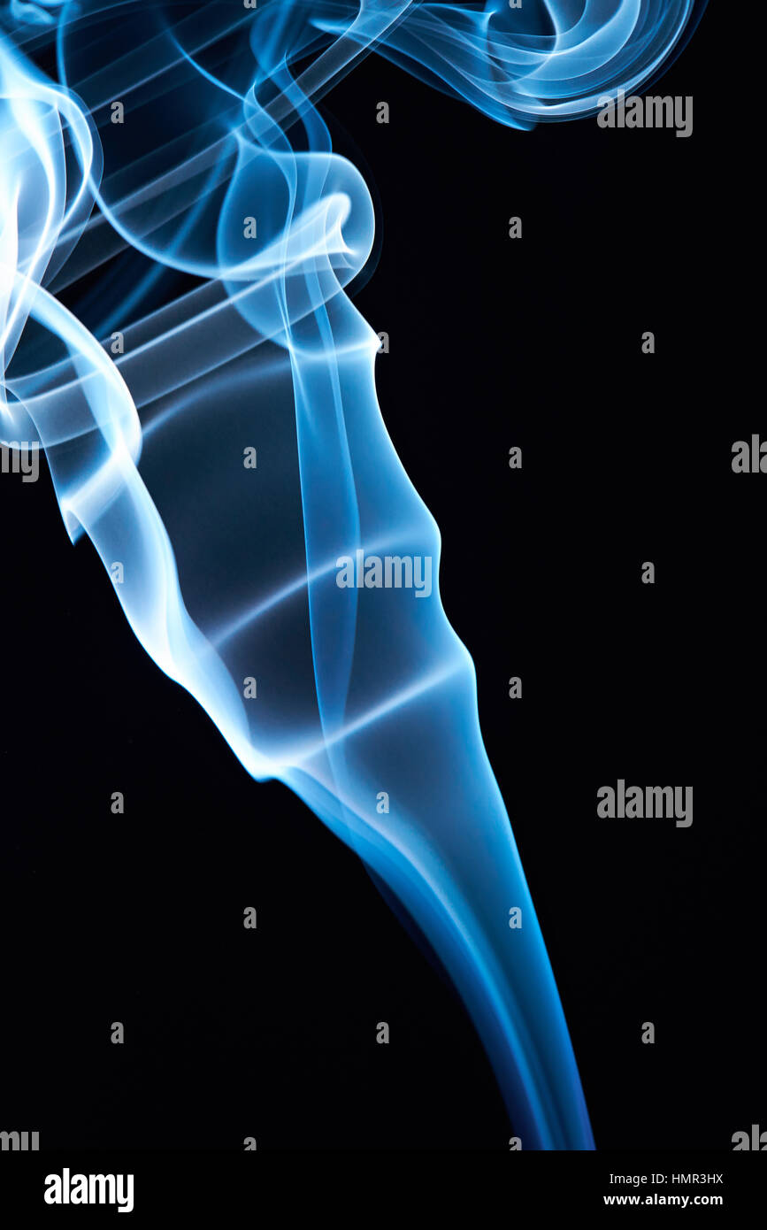 macro of stylish blue smoke curves on black background Stock Photo - Alamy