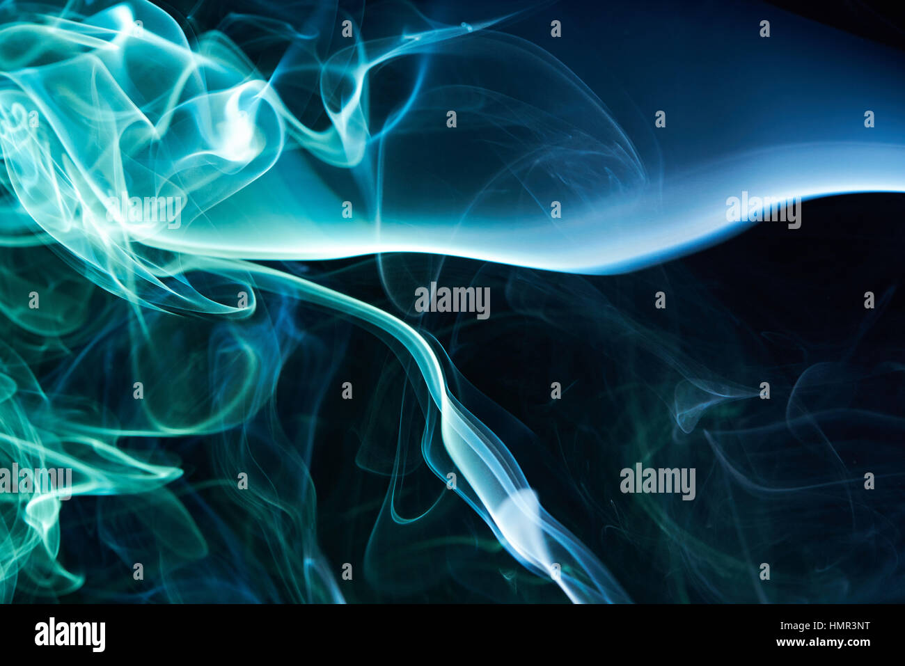 abstract cloud of blue smoke on black background Stock Photo - Alamy