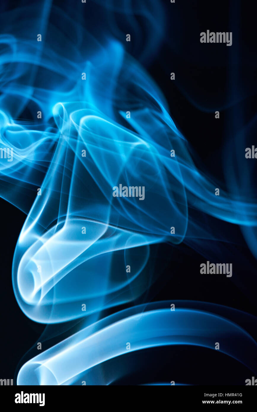 close up of blue smoke curves on black background Stock Photo - Alamy