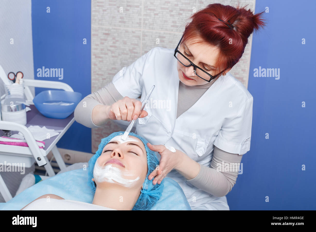 beautician applying mask on the face Stock Photo