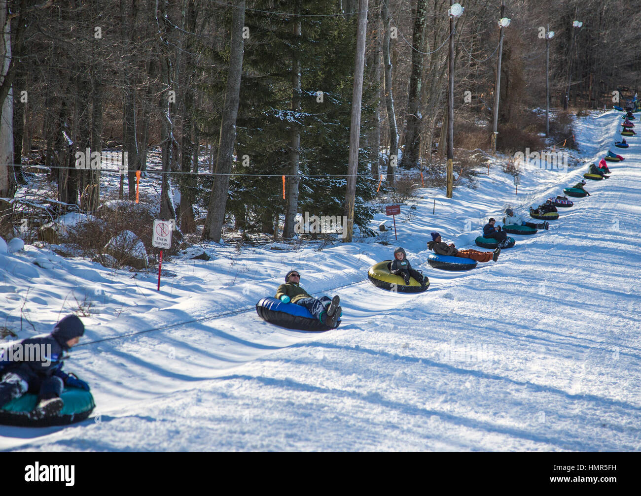 Snow tubes going up a hill Stock Photo Alamy