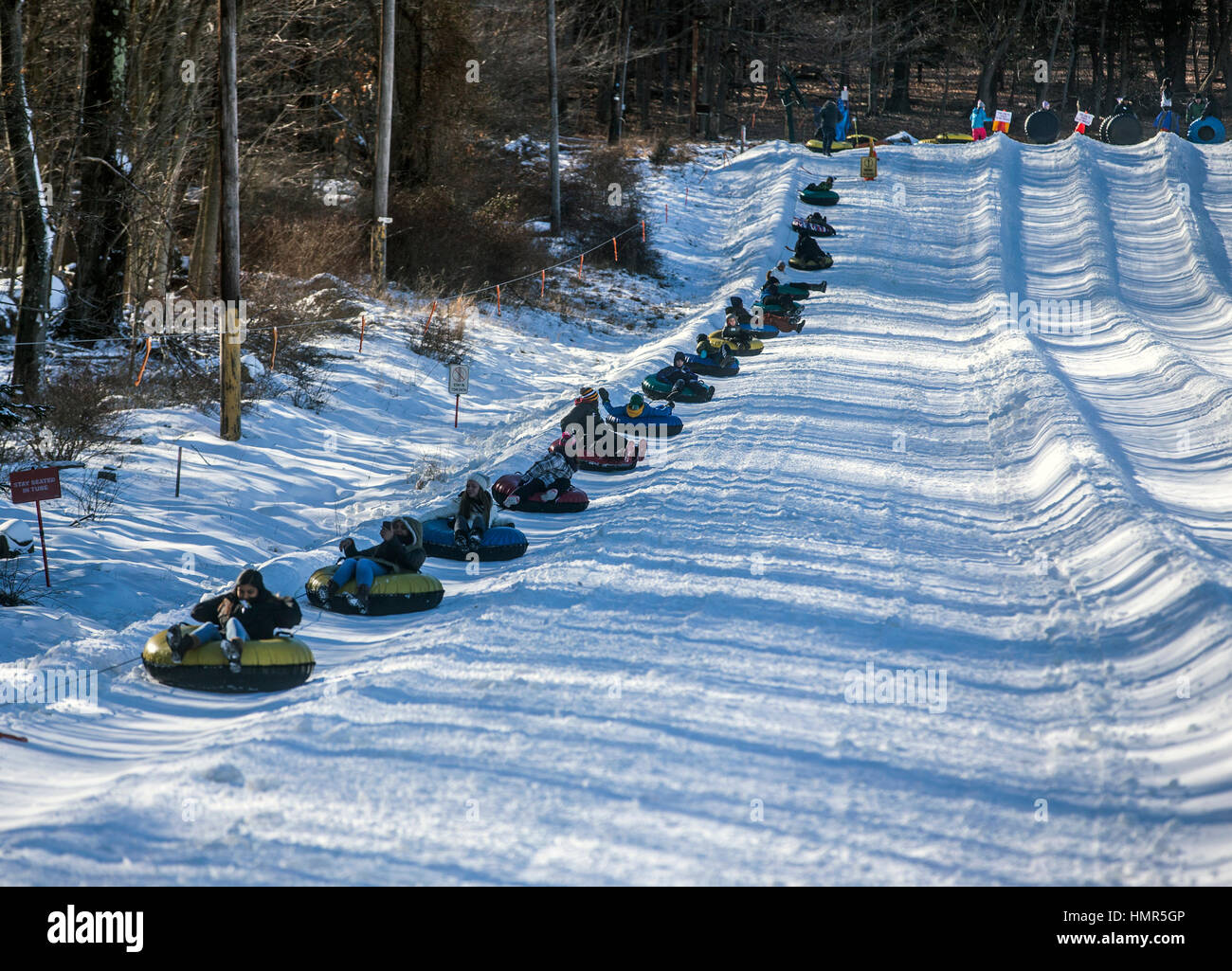 Snow tubes going up a hill Stock Photo Alamy