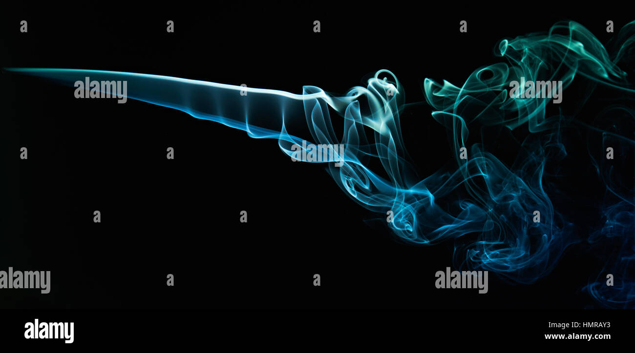 close up blue smoke curve on black isolated Stock Photo - Alamy