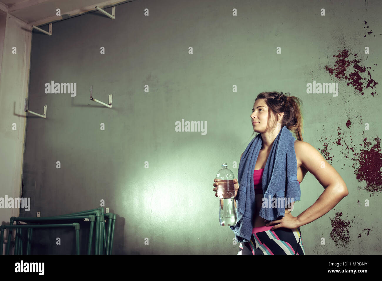 Young fit girl drinking fresh water after hard training Stock Photo - Alamy