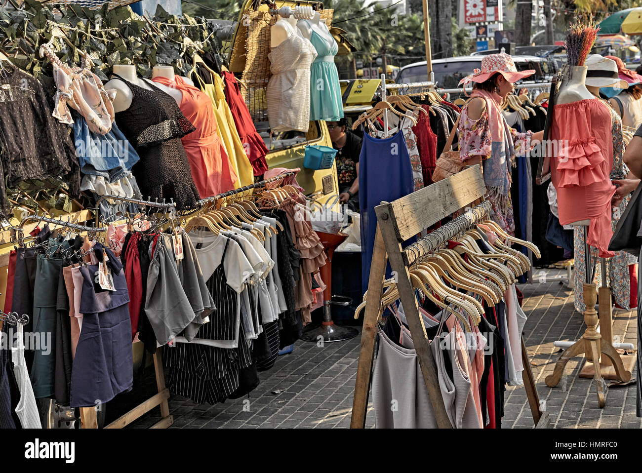 Women clothes shopping at a Thailand street market. S. E. Asia Stock Photo
