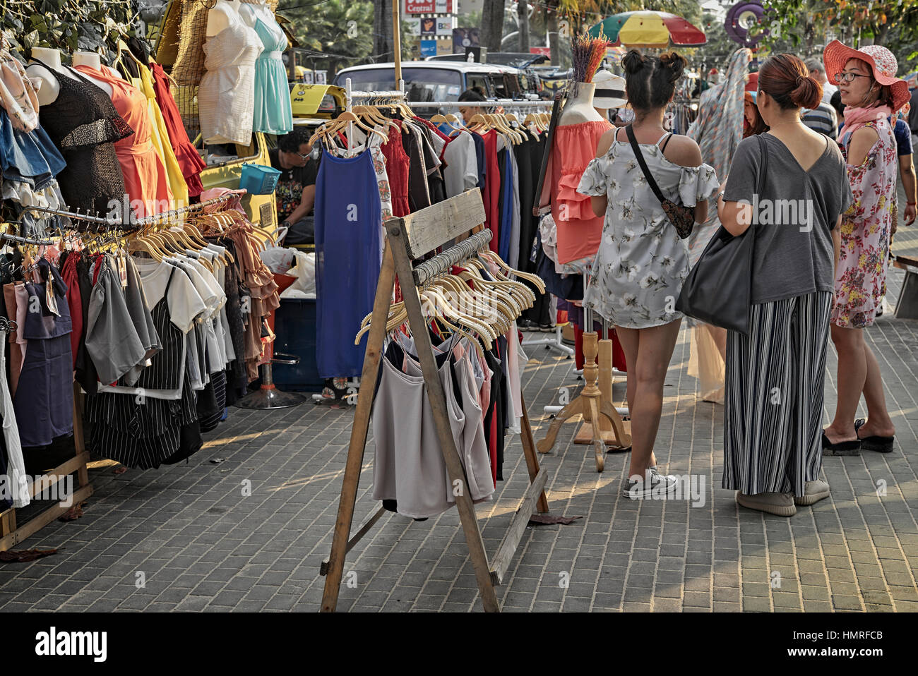 Women clothes shopping at a Thailand street market. S. E. Asia Stock Photo