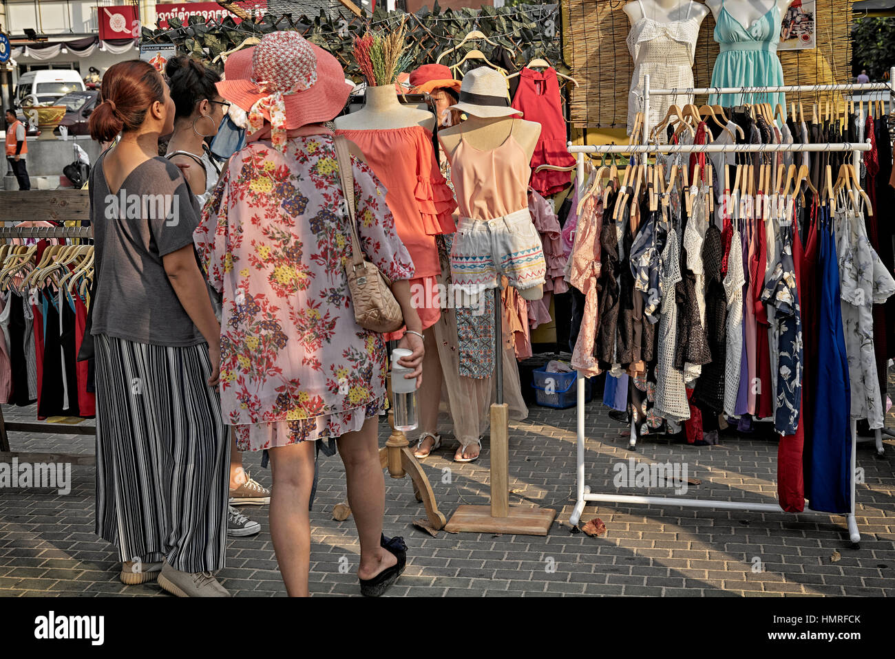 Women clothes shopping at a Thailand street market. S. E. Asia Stock Photo