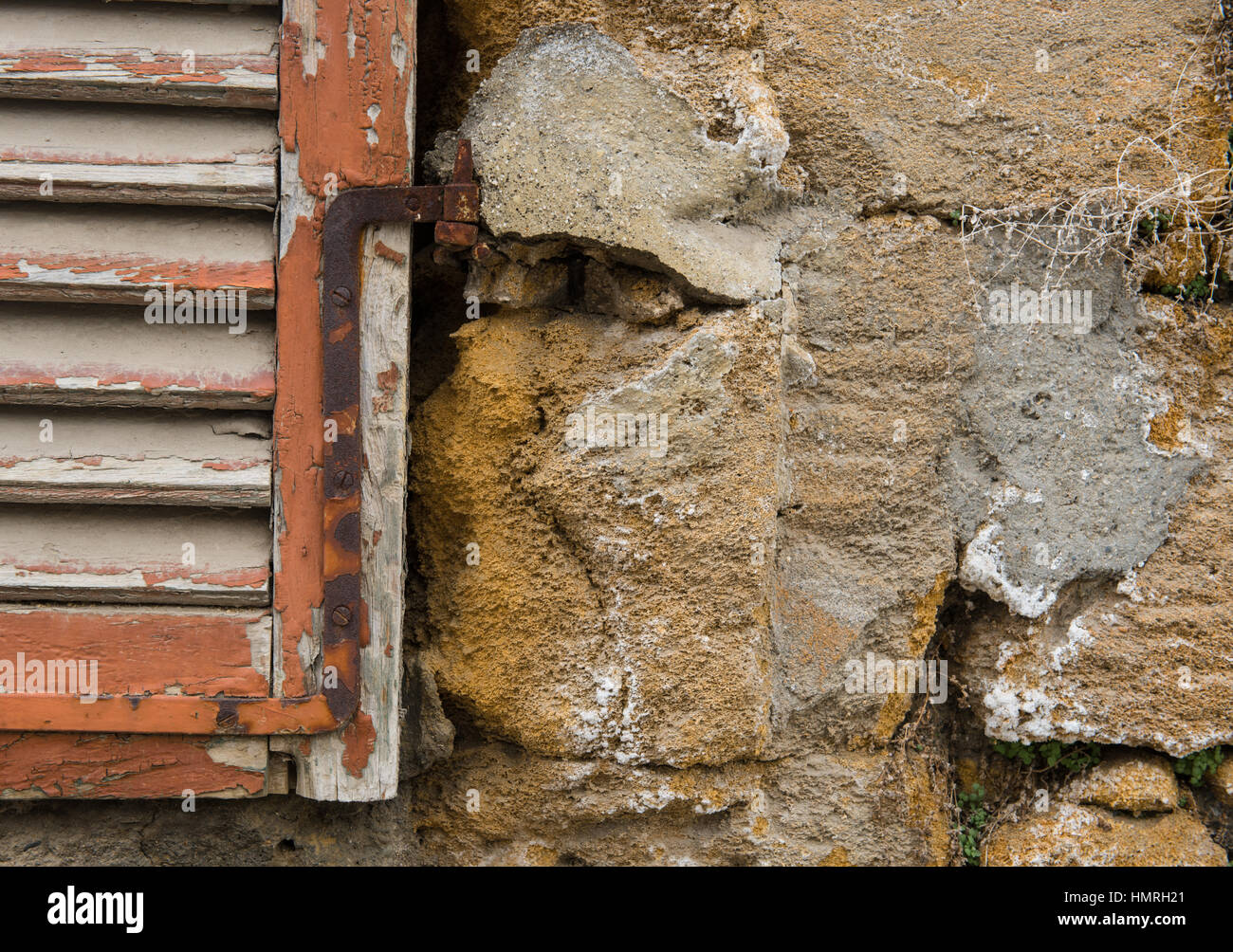 Red closed old stained wooden window on a yellow grungy wall Stock ...