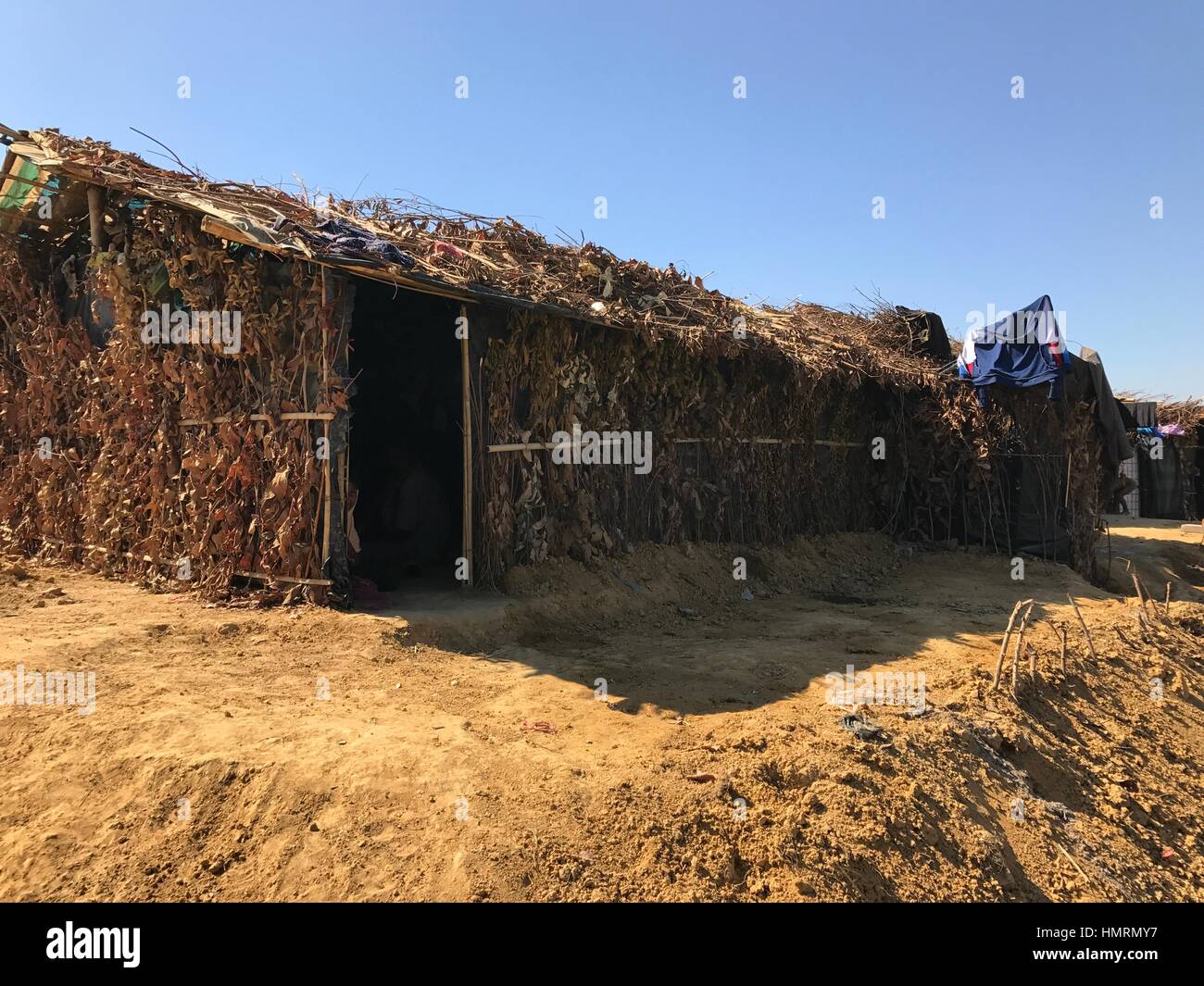 Ukhiya, Bangladesh. 26th Jan, 2017. These makeshift huts, made of bamboo slips and polyethylene papers as roof and covered by tree branches, are built by the Rohingya Muslims who crossed into Bangladesh facing persecution in neighbouring Myanmar. The photograph was taken by Nazrul Islam near Kutupalang refugee camp in Ukhiya sub-district of Cox·s Bazar on January 26, 2017. Photo: Nazrul Islam/dpa/Alamy Live News Stock Photo