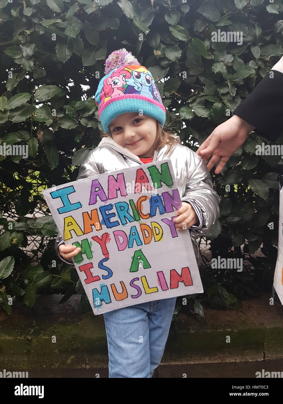 London, UK. 4th February, 2017. Small girl with placard at 4th Feb 2017 London March against Donald Trump Credit: Pauline A Yates/Alamy Live News Stock Photo