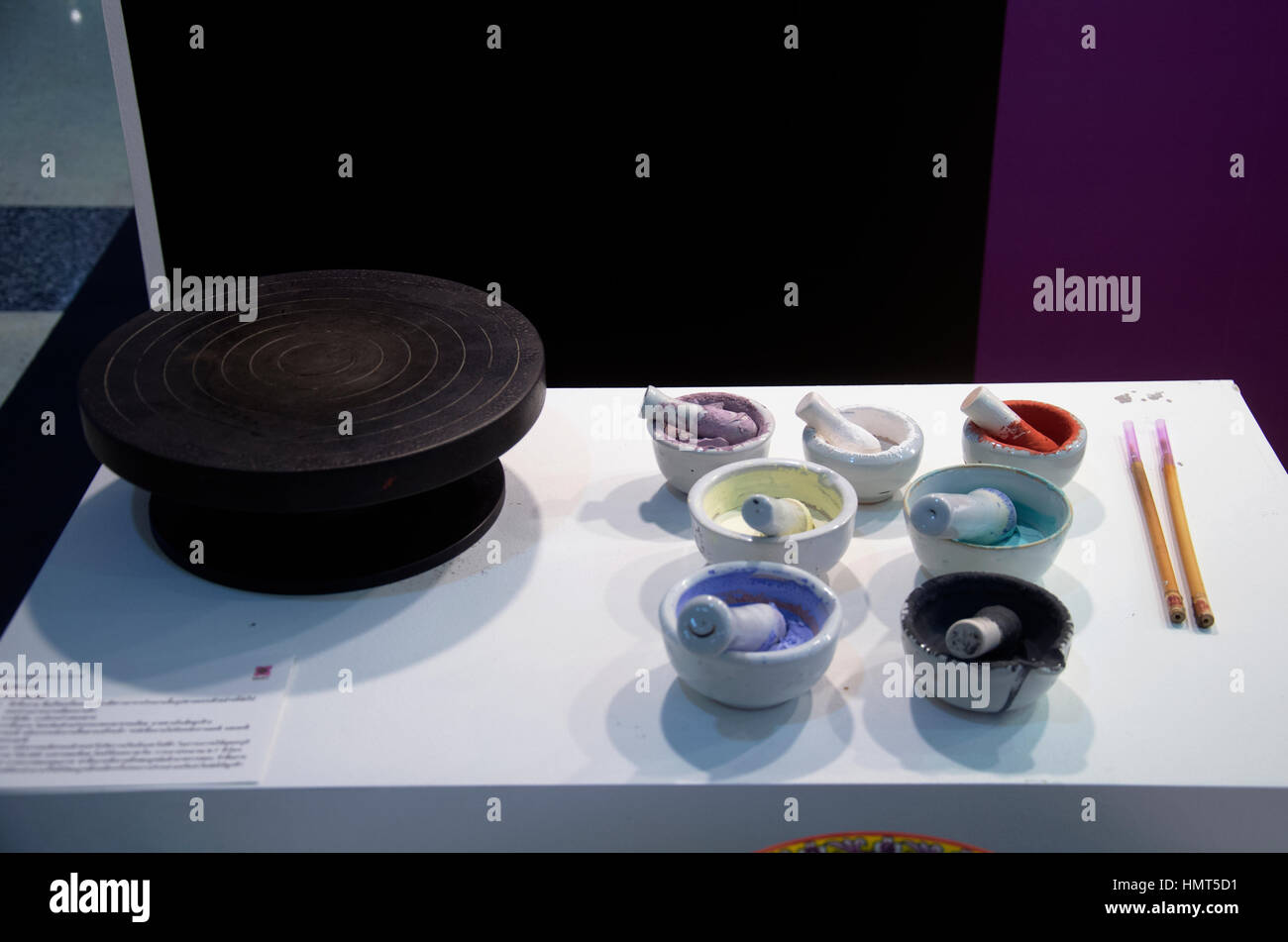 Colorful acrylic powder color in kitchen mortar and pestle or mortar ...