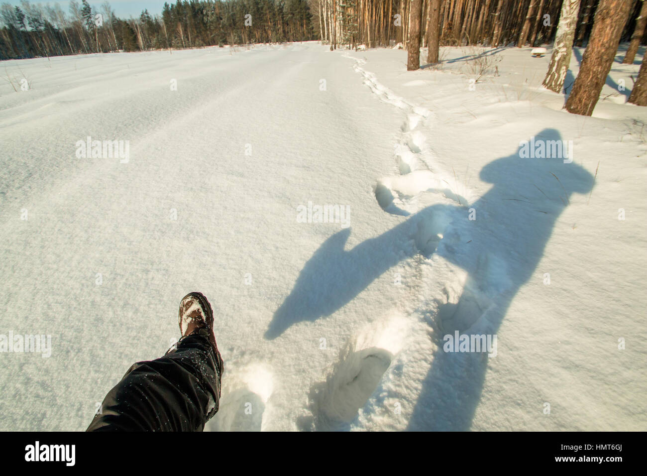 man in the woods makes selfie. Selfies time on snow Stock Photo