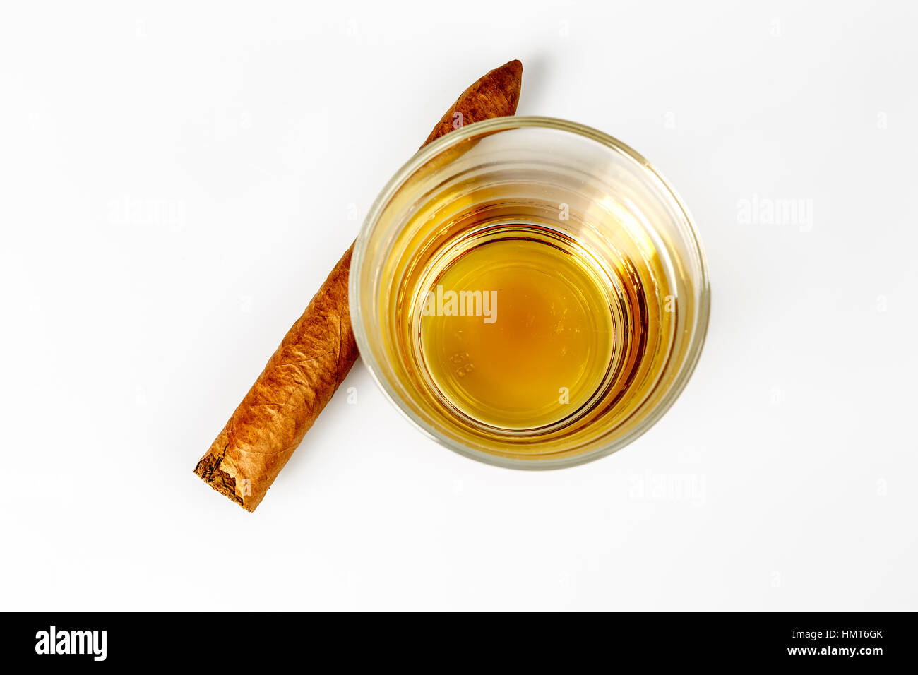 expensive drink of whisky or rum with cigar on white. gentleman relax concept Stock Photo