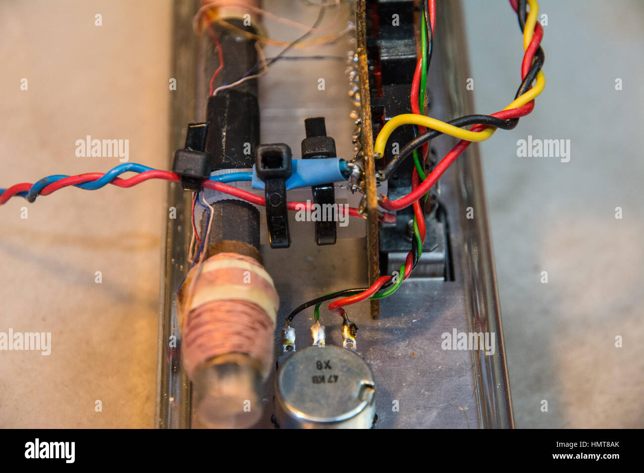 Reuse and Repair. Repairing a 50 yr old Roberts battery radio Stock