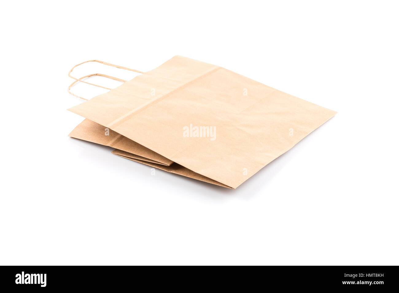 Recycled paper kraft shopping bag isolated on white background Stock