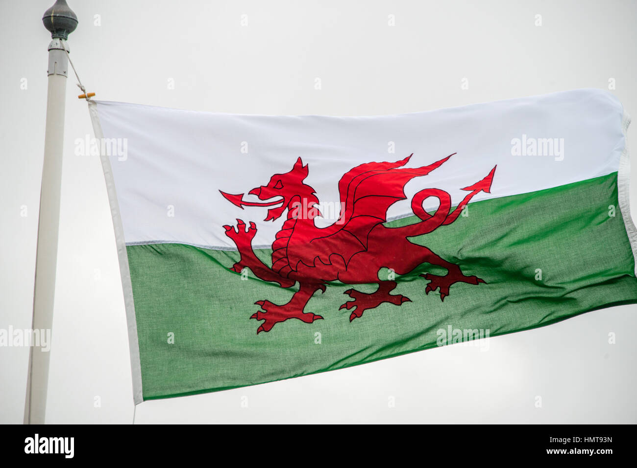 The Welsh flag against a cloudy sky Stock Photo