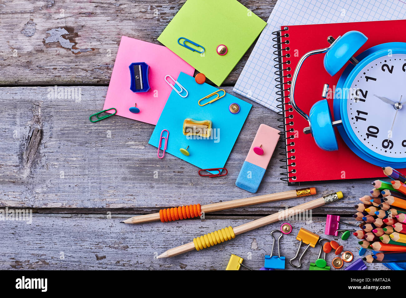 Notebook, pencils and clamps. Stock Photo