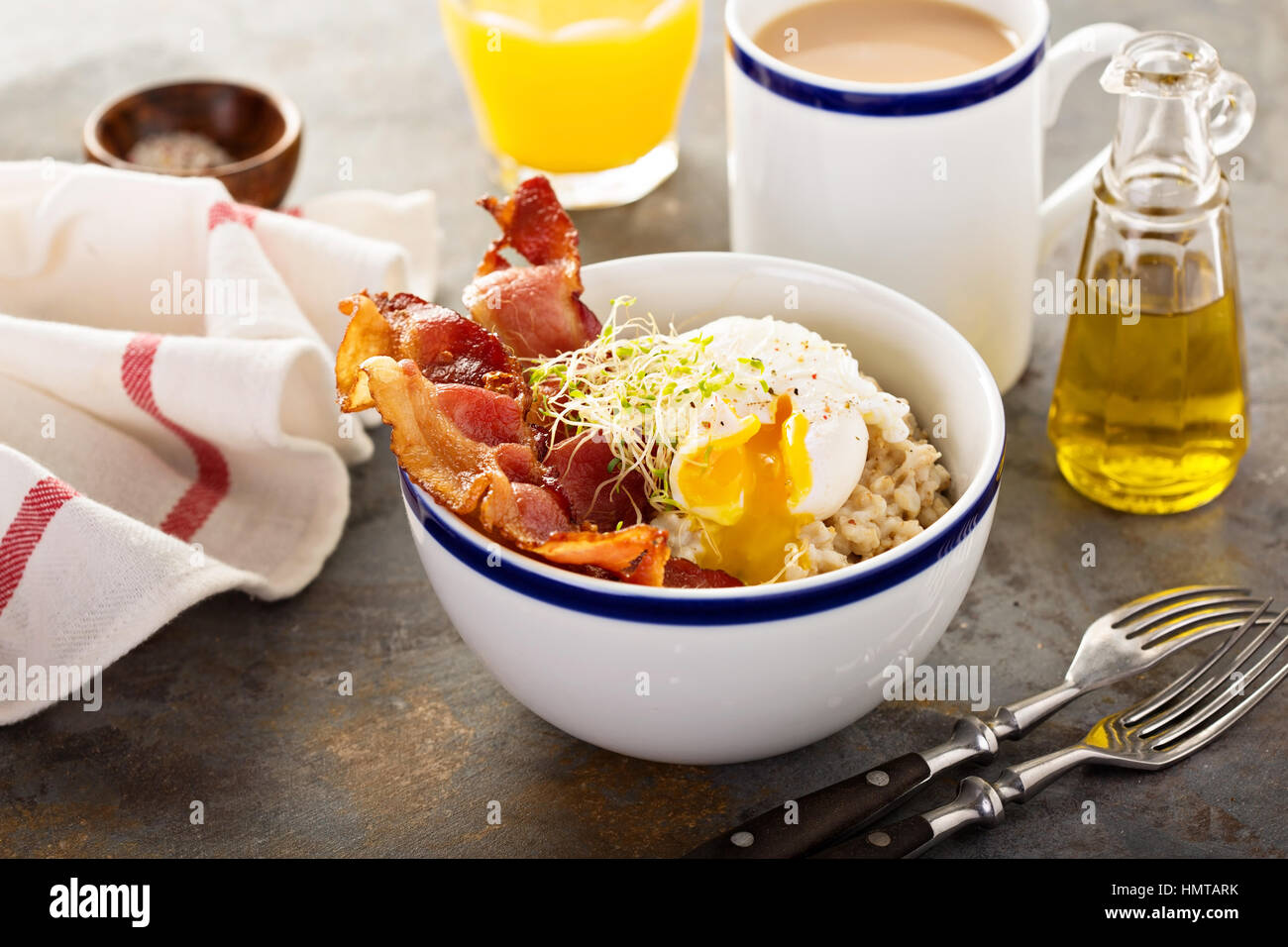 Savory oatmeal porridge with poached egg and bacon Stock Photo Alamy