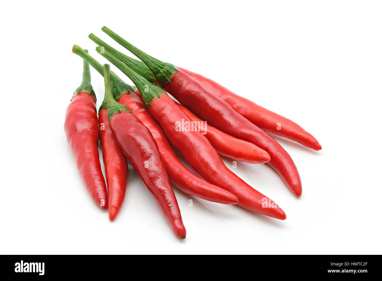Group of red chilli pepper on a white background Stock Photo - Alamy