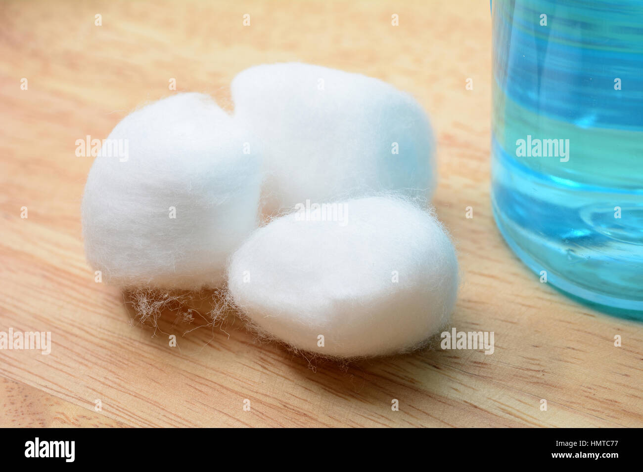 Close up Cotton ball on wooden table Stock Photo - Alamy