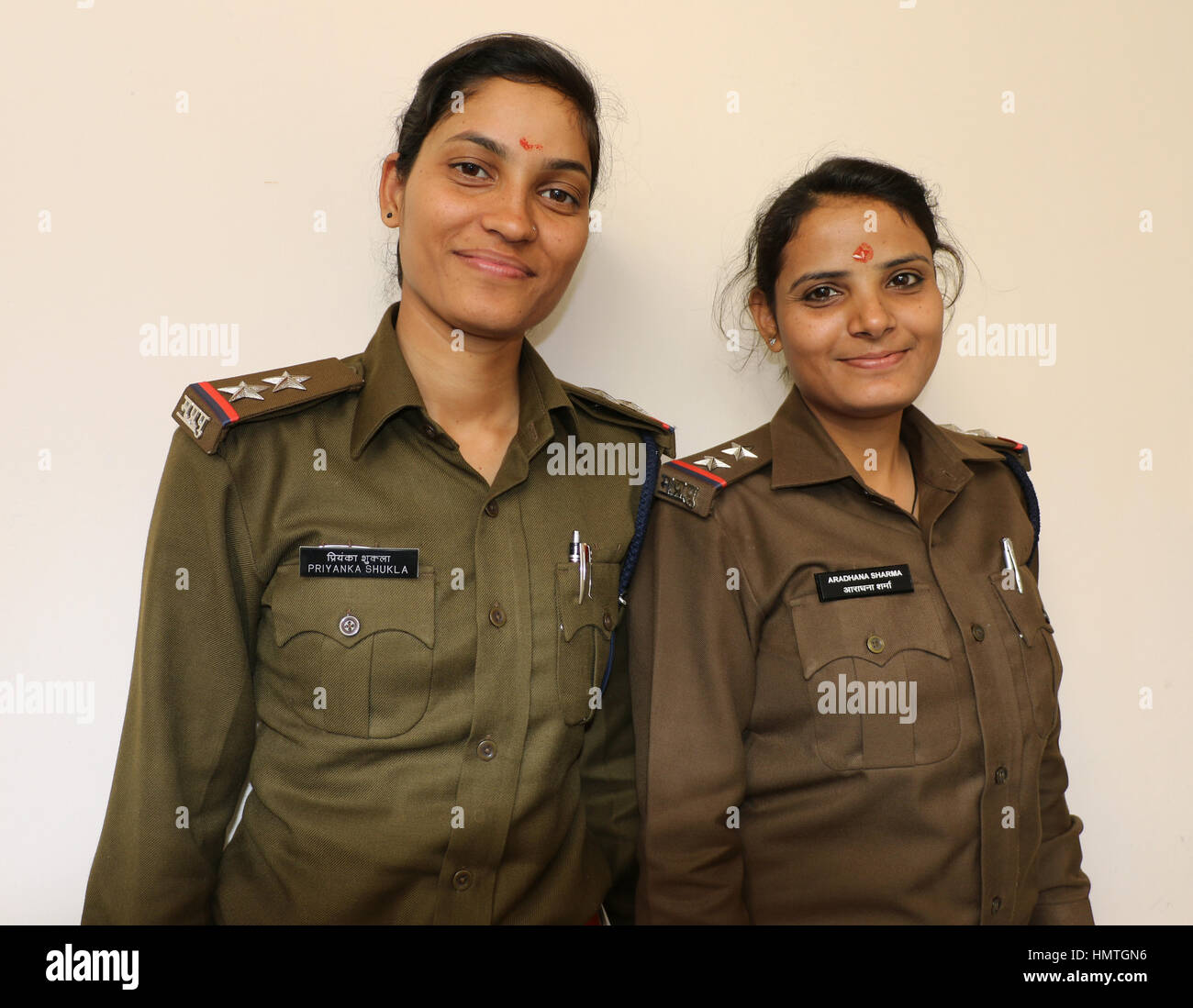 Two lady police officers posing with a sweet smile. Stock Photo