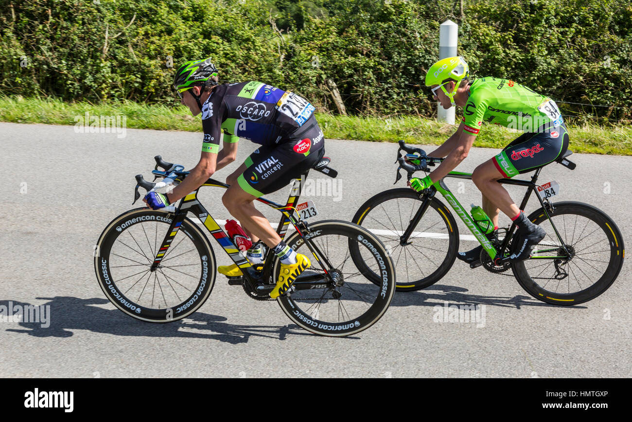 Quineville,France- July 2, 2016: The cyclists Anthony Delaplace of Fortuneo-Vital Concept Team and Alex Howes of Cannondale-Drapac Team riding in the  Stock Photo