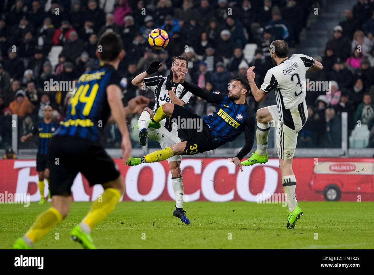 Turin, Italy. 5th Feb, 2017. Danilo D'Ambrosio (center) of FC Internazionale Miralem Pjanic and Giorgio  Chiellini of Juventus FC compete for the ball during the Serie A football match between Juventus FC and FC Internazionale. Credit: Nicolò Campo/Alamy Live News Stock Photo