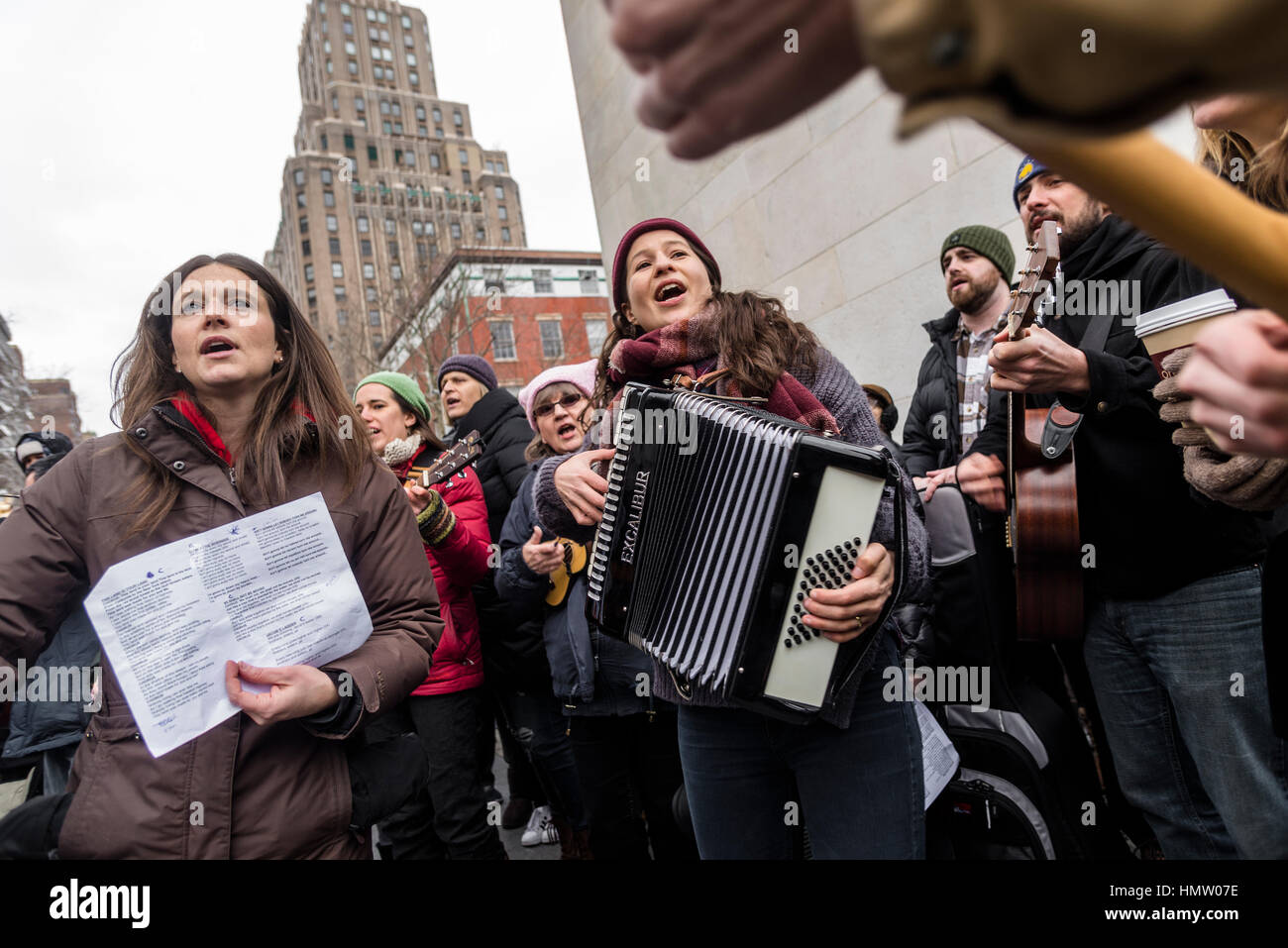 New York, USA. 5th Feb, 2017. 'This is what democracy sounds like': Several hundred people gathered beneath the arch in Washington Square Park for a community sing along, playine folk songs to benefit the ACLU (American Civil Liberties Union) and NYCLU (New York Civil Liberties Union). Credit: Stacy Walsh Rosenstock/Alamy Live News Stock Photo