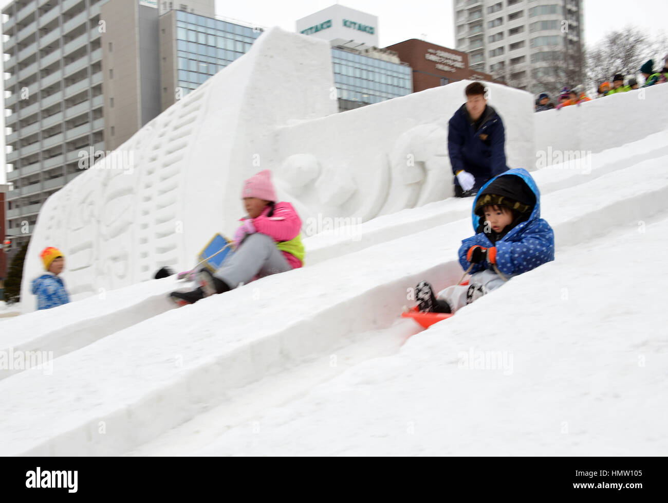 Sapporo, Japan. 6th Feb, 2017. Children play on the snow slides at the