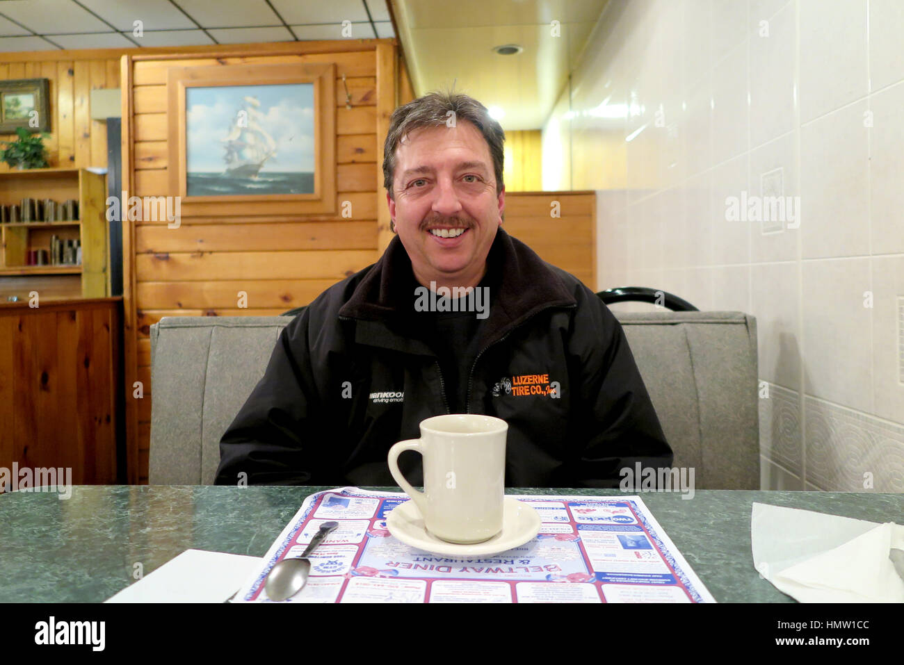 The 51 year old Mark Ondishin sits with a cup of coffee in Hazleton, Pennsylvania, US. The city has many citizens of Latin American descent. It sits within a district where resident overwhelmingly voted for the Republican Donald Trump. Photo: Maren Hennemuth/dpa Stock Photo