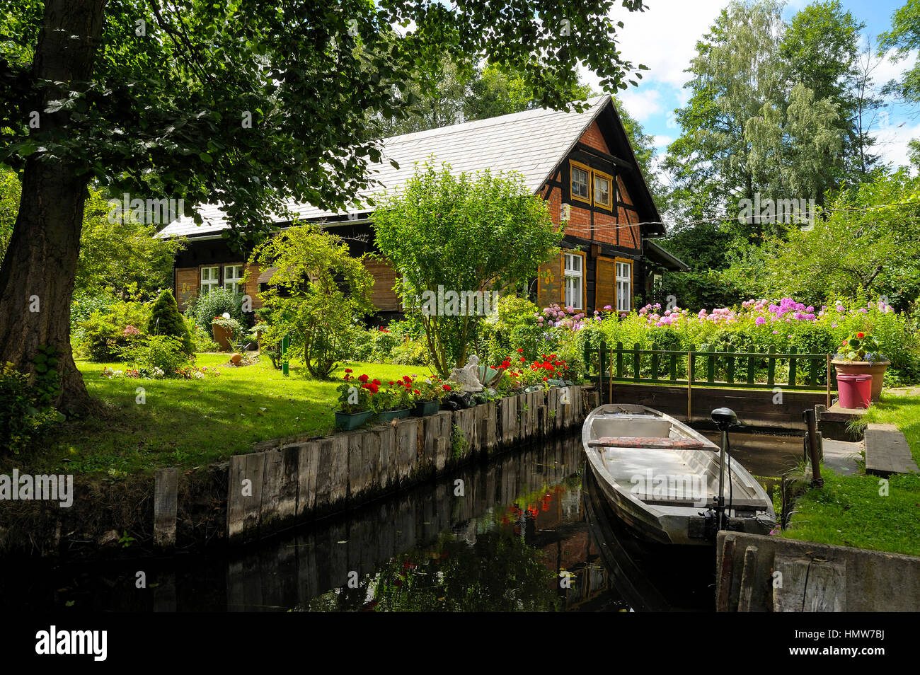 Spreewald house with boat on Fließ river, Lehde district, Lübbenau