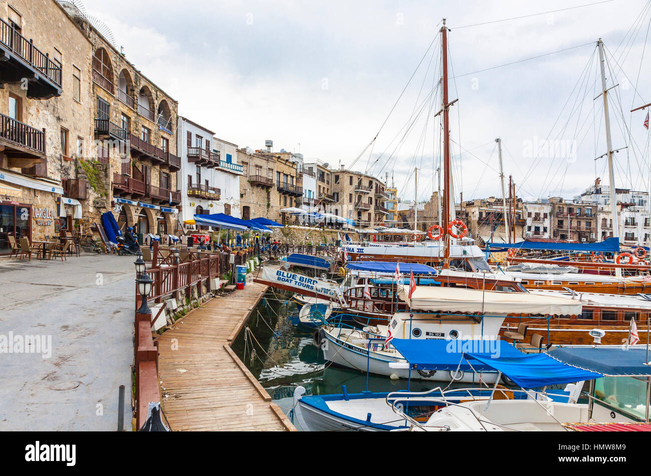 KYRENIA, CYPRUS - JANUARY 19, 2015: Winter view of Kyrenia old harbour in Northern Cyprus. Kyrenia (Turkish: Girne) is a city on the northern coast of Stock Photo