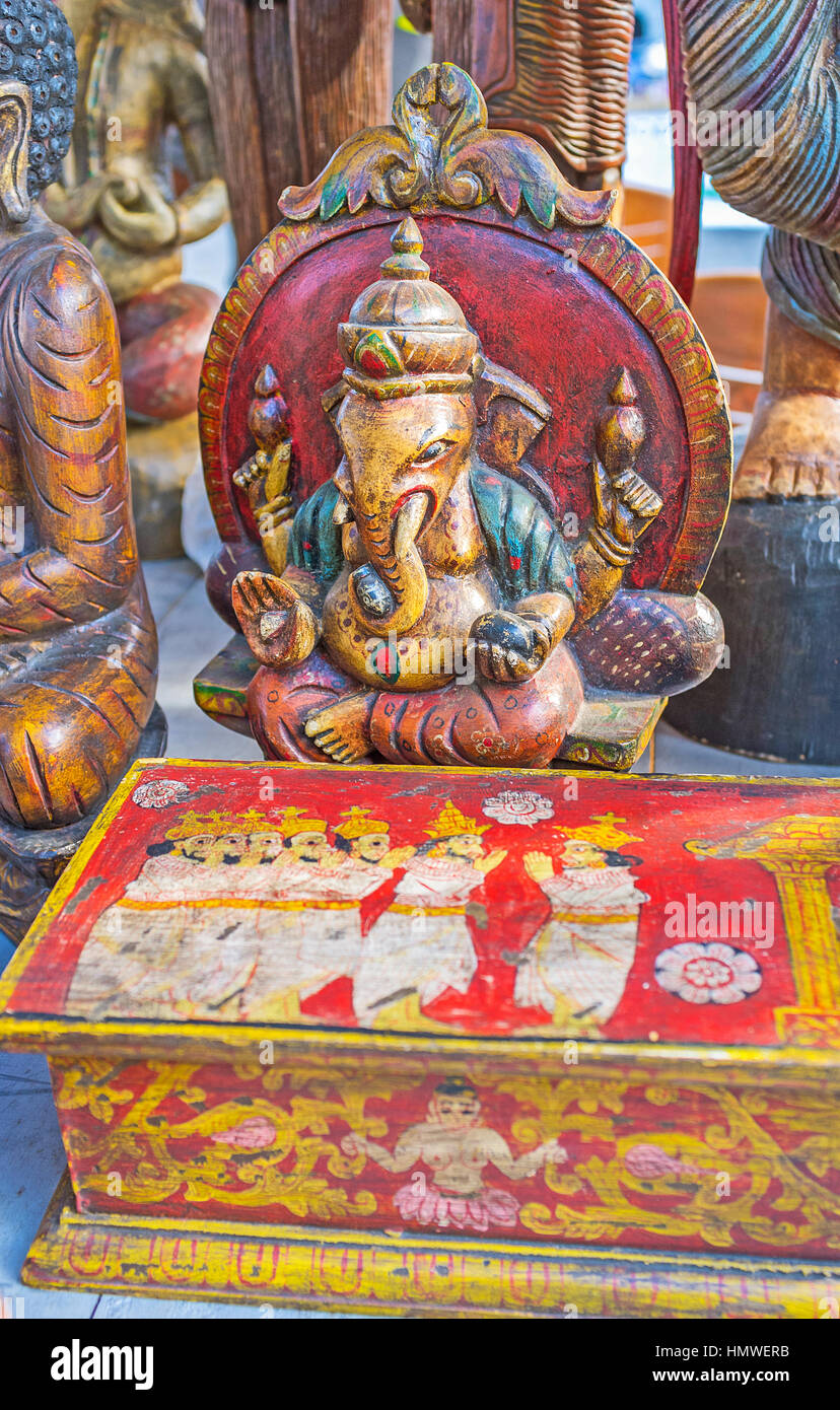 The small wooden sculpture of Ganesha and the colorful wooden box
