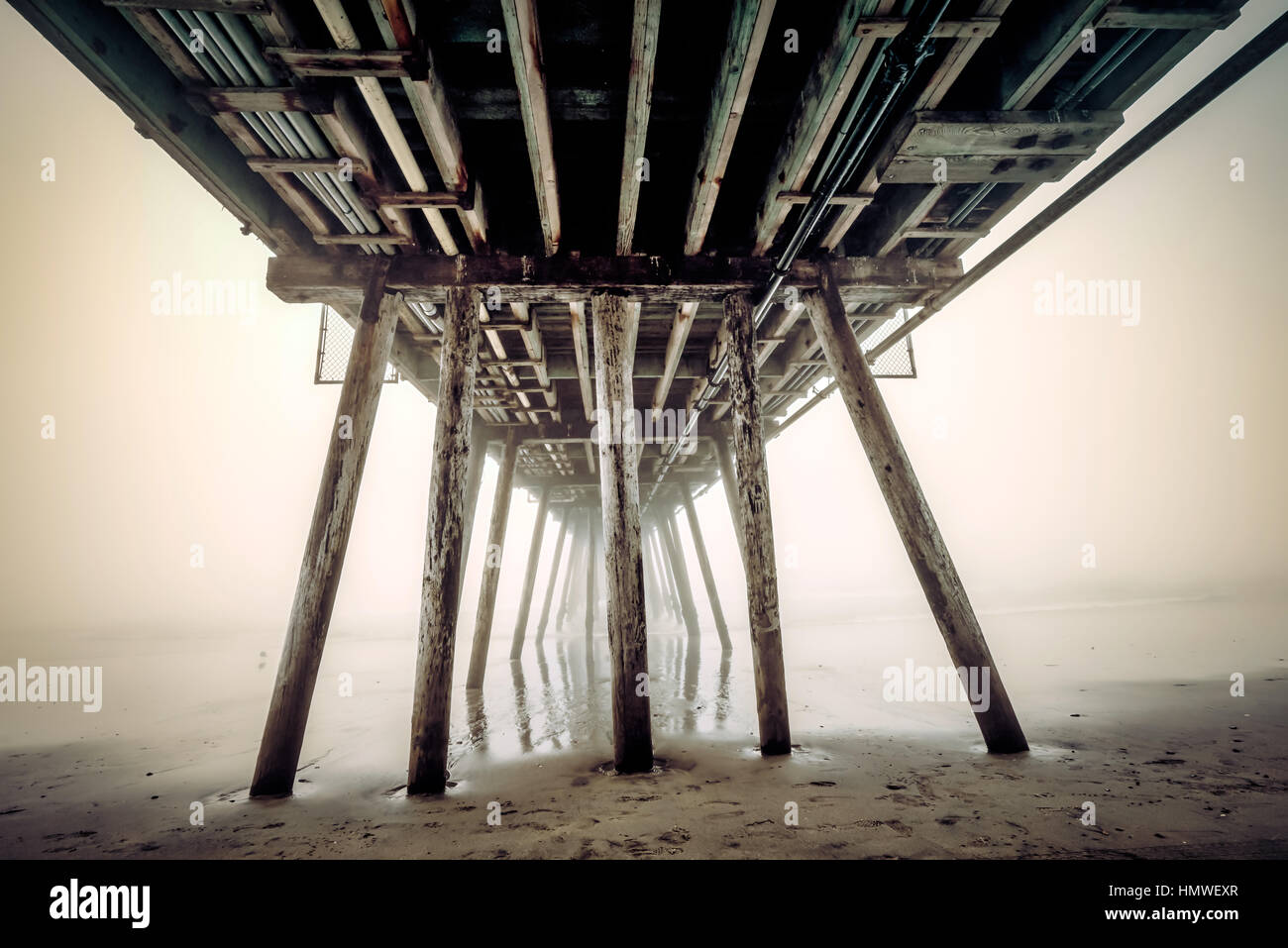 In the fog under the Imperial Beach pier. Stock Photo