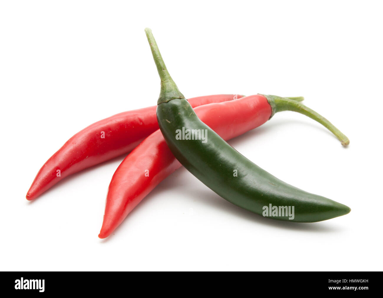 Red and green hot chili peppers isolated on white background closeup ...