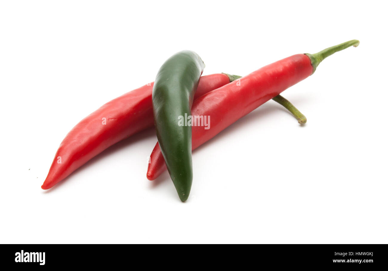 Red and green hot chili peppers isolated on white background closeup ...