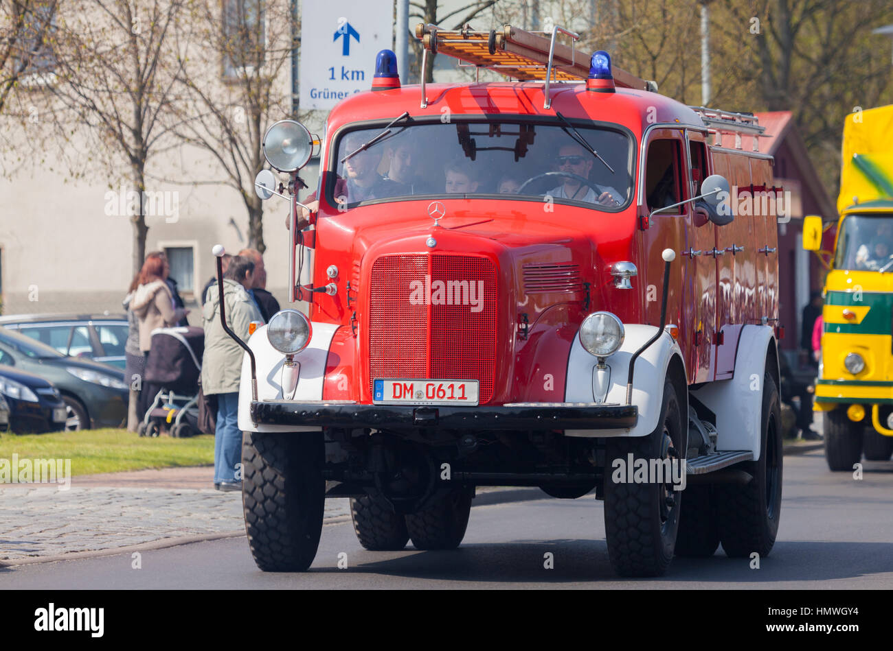 ALTENTREPTOW / GERMANY - MAY 1, 2016: german mercedes benz fire truck oldtimer drives on a street at oldtimer show on may 1, 2016 in altentreptow, ger Stock Photo