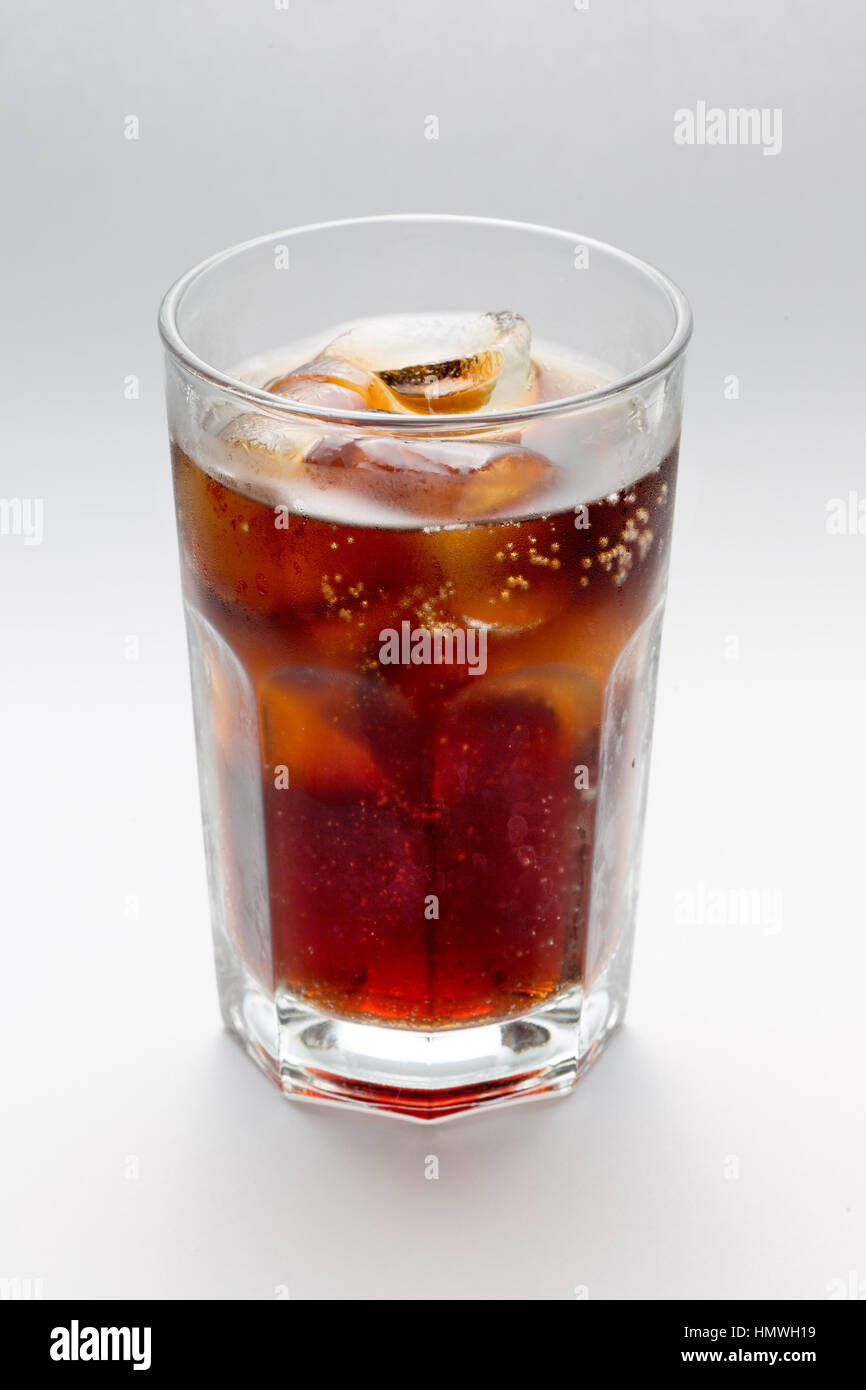 Glass with a glass of Coke rum, cocktai ice cubes Stock Photo