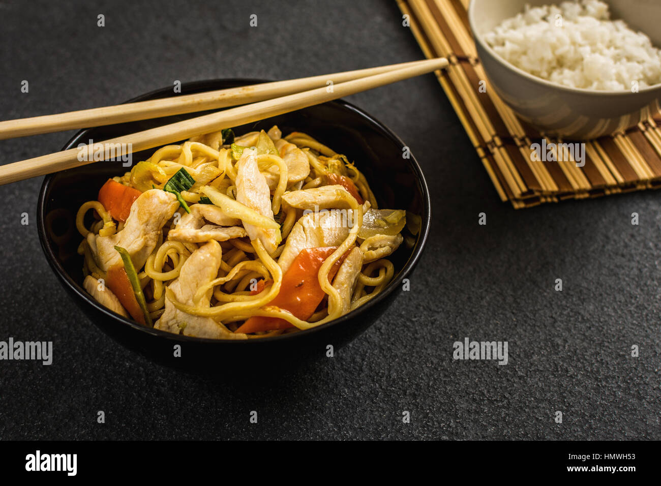 Asian or chinese noodles with chicken noodles and vegetables Stock