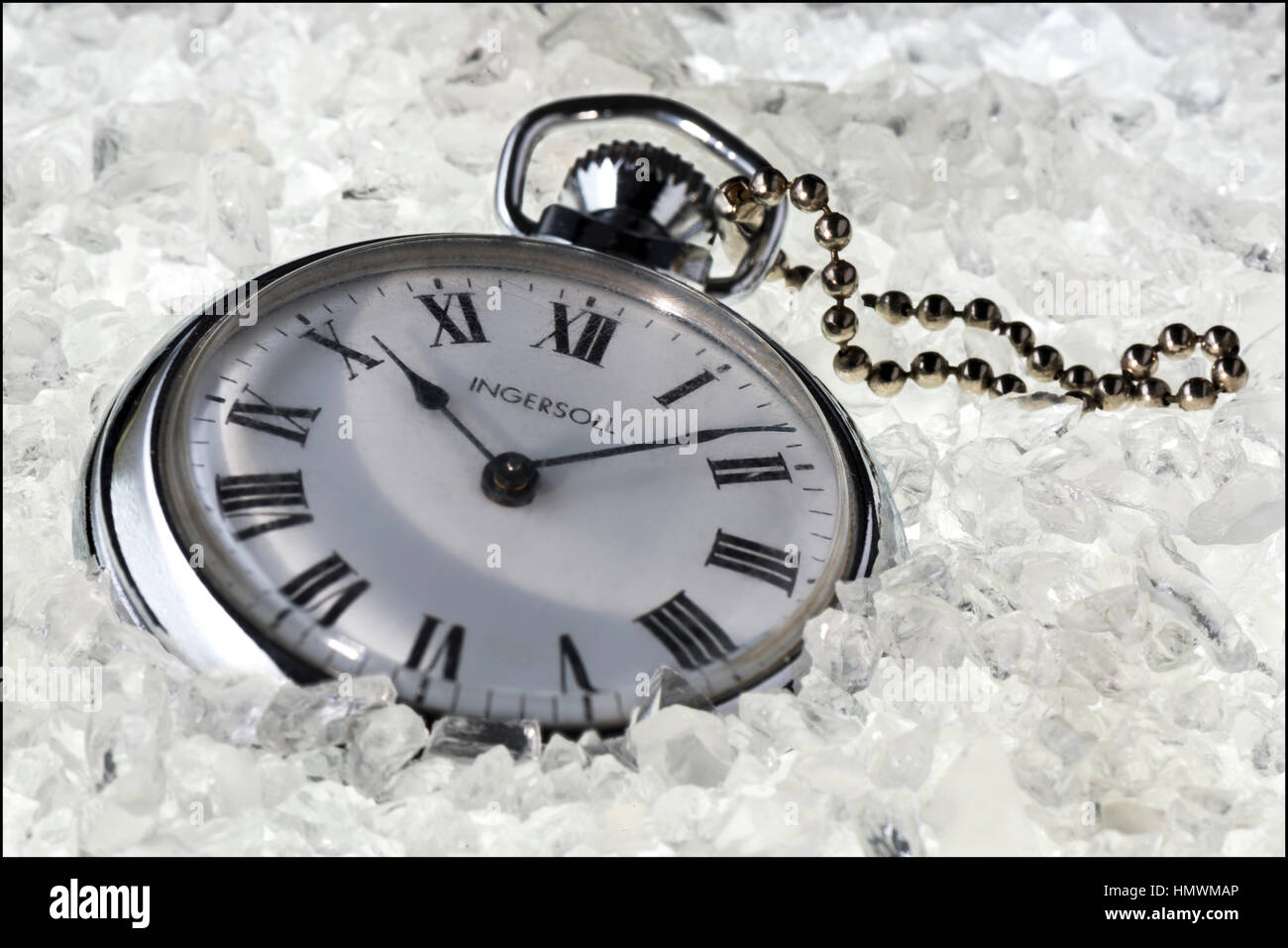 This my late grandfathers Ingersoll pocket watch.   I places some artificial, crushed ice onto a glass table. I placed the watch in the ice, and used  Stock Photo