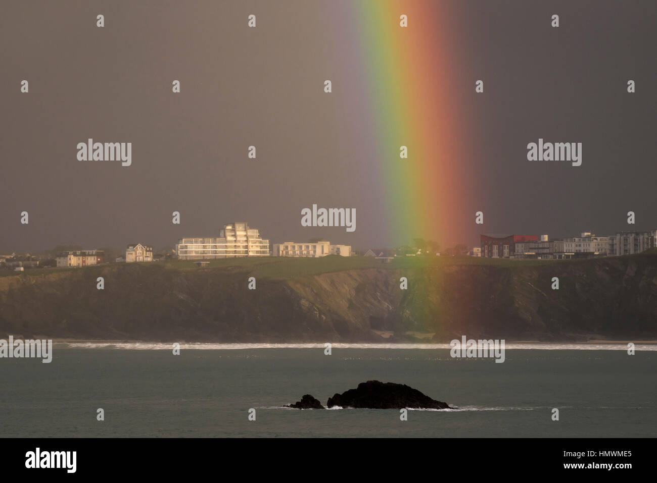 A closeup view of a rainbow over the coast of Newquay, Cornwall, England. UK weather. Stock Photo