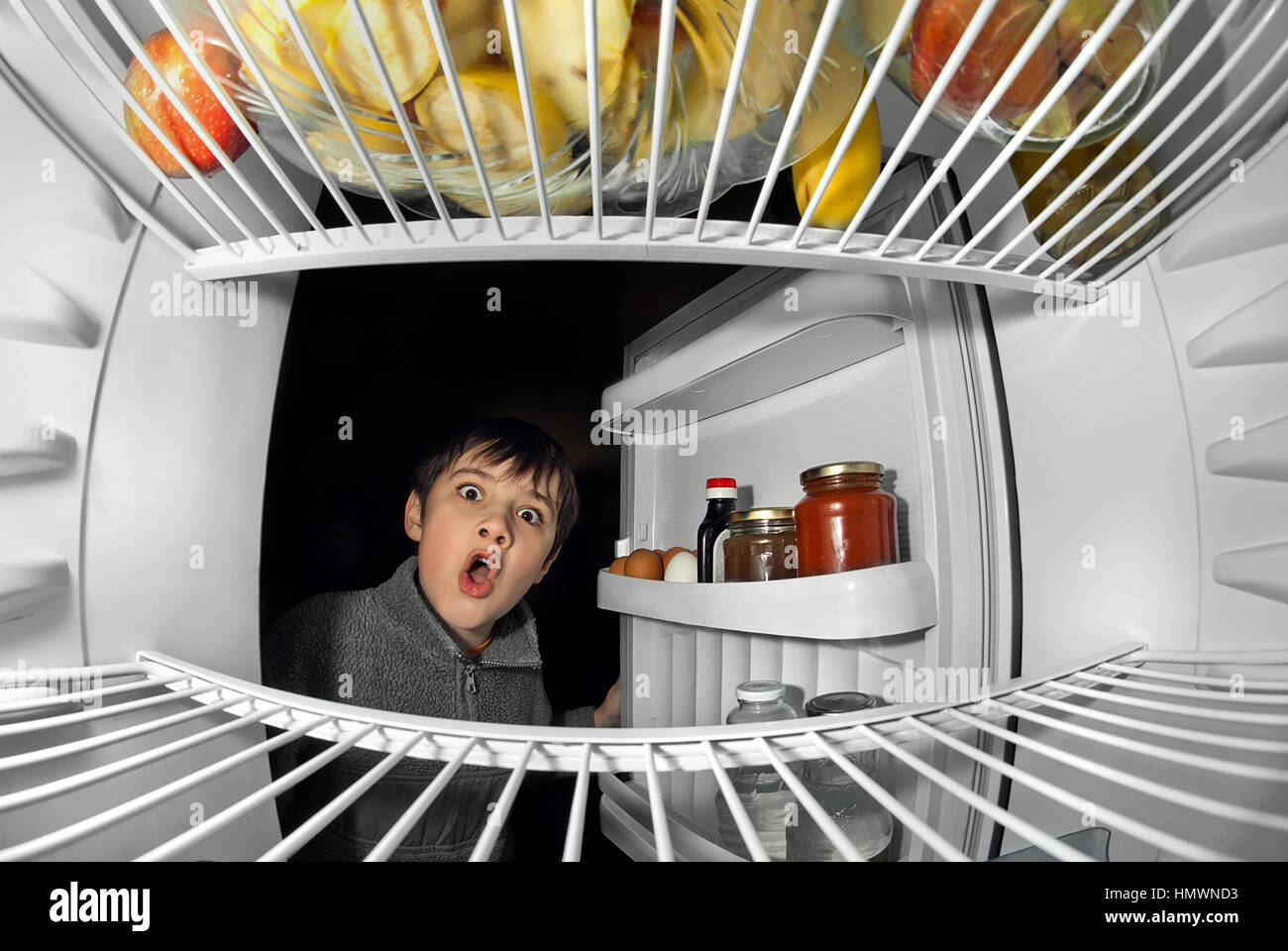 boy takes food from the refrigerator Stock Photo Alamy