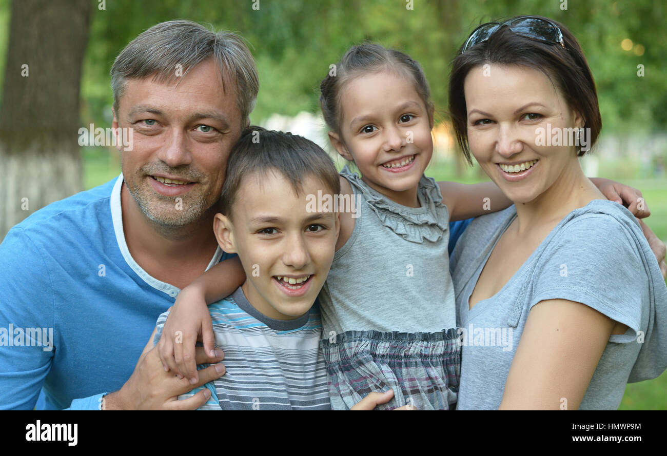 Happy Family resting in a summer park Stock Photo - Alamy