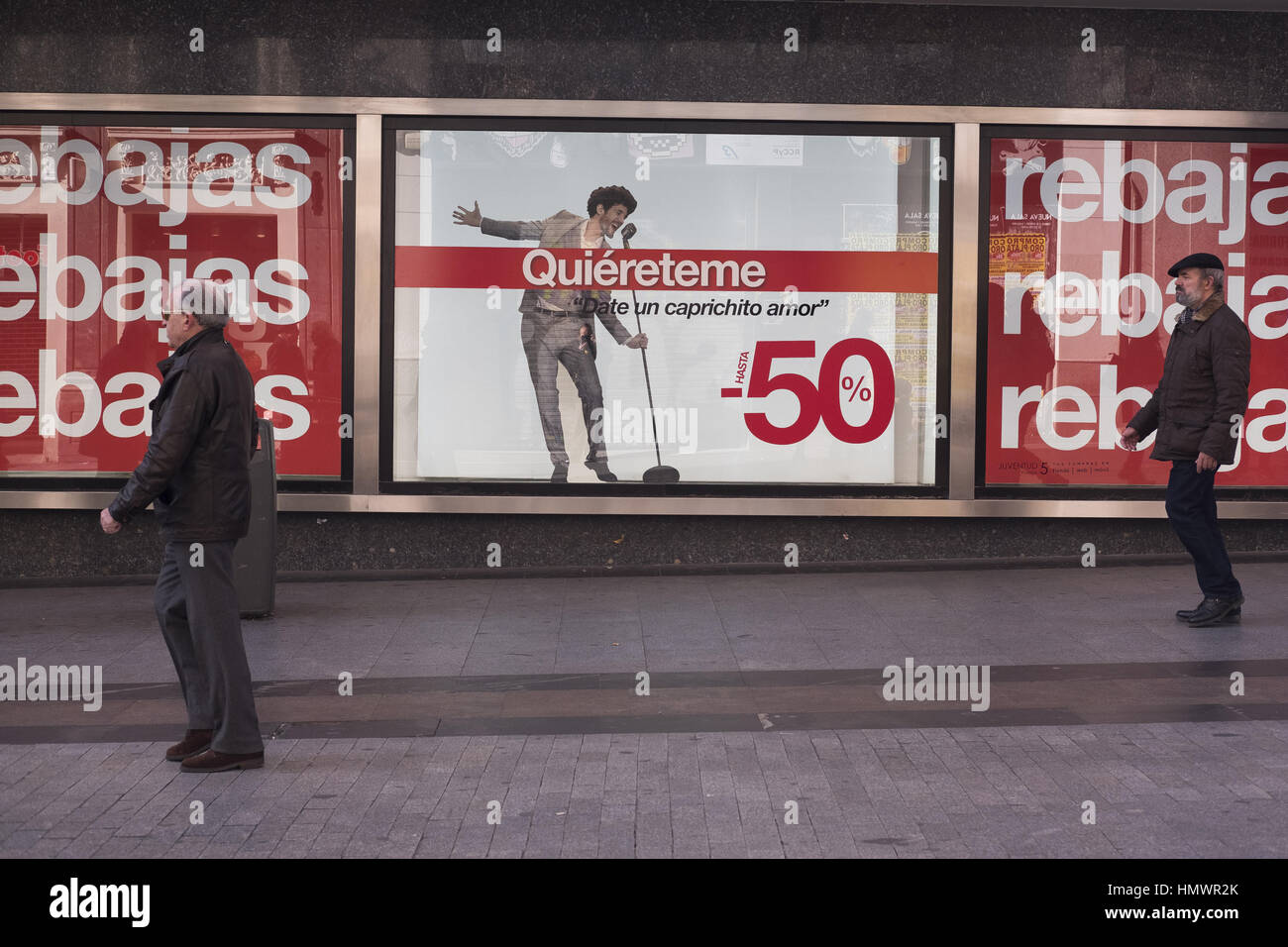 A shop front sign announces discounts on the first day of the winter